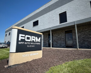Exterior view of FORM Off-Site Solutions building; sign reads 'FORM Off-Site Solutions by JE Dunn' with address 1313 Vernon.
